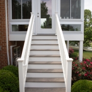 Exterior stairs leading to the deck and sunroom.