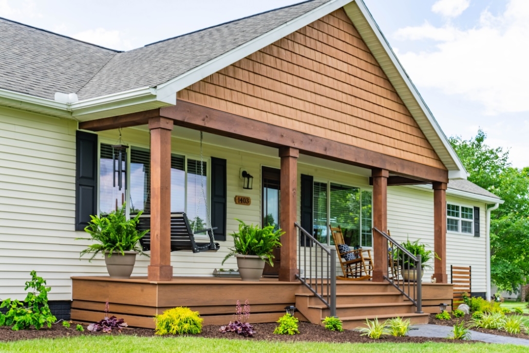 Wide shot of the front of a house in Grottoes, Virginia with a new front porch.