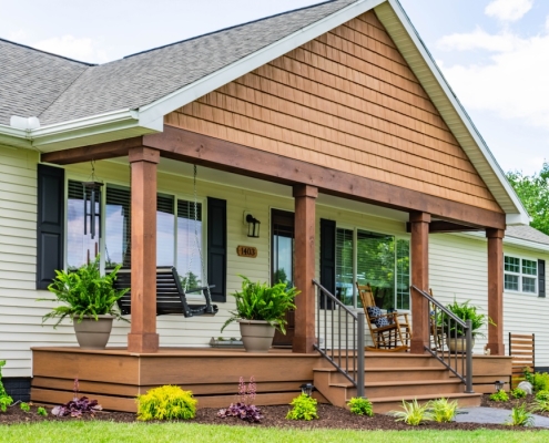 Wide shot of the front of a house in Grottoes, Virginia with a new front porch.