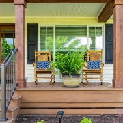 Two rocking chairs side by side on a front porch in Grottoes, VA.