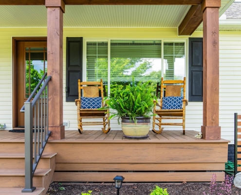 Two rocking chairs side by side on a front porch in Grottoes, VA.